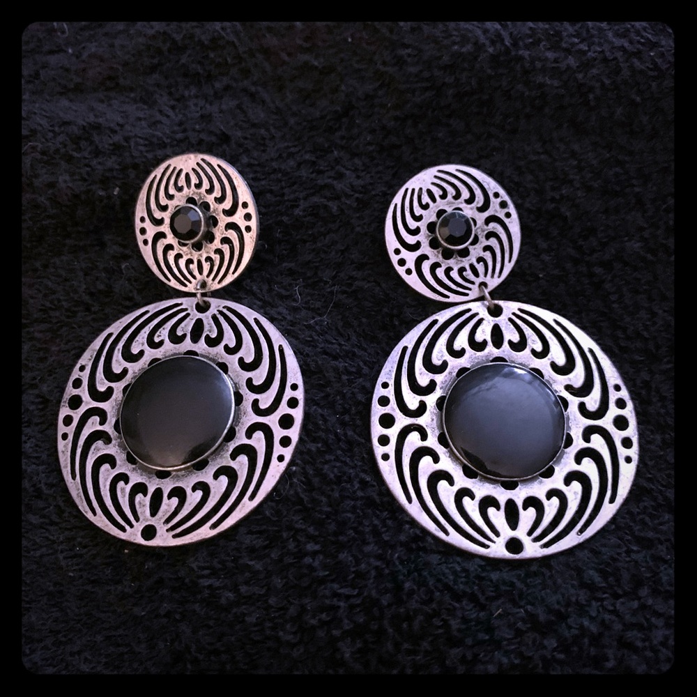 Silver and black earrings.